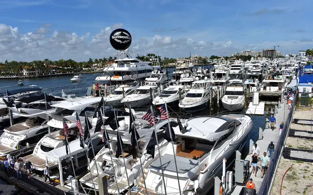 Bahia Mar Yachting Center: numerous luxury yachts docked side-by-side along pontoons at a sunny boat show on the Intracoastal Waterway