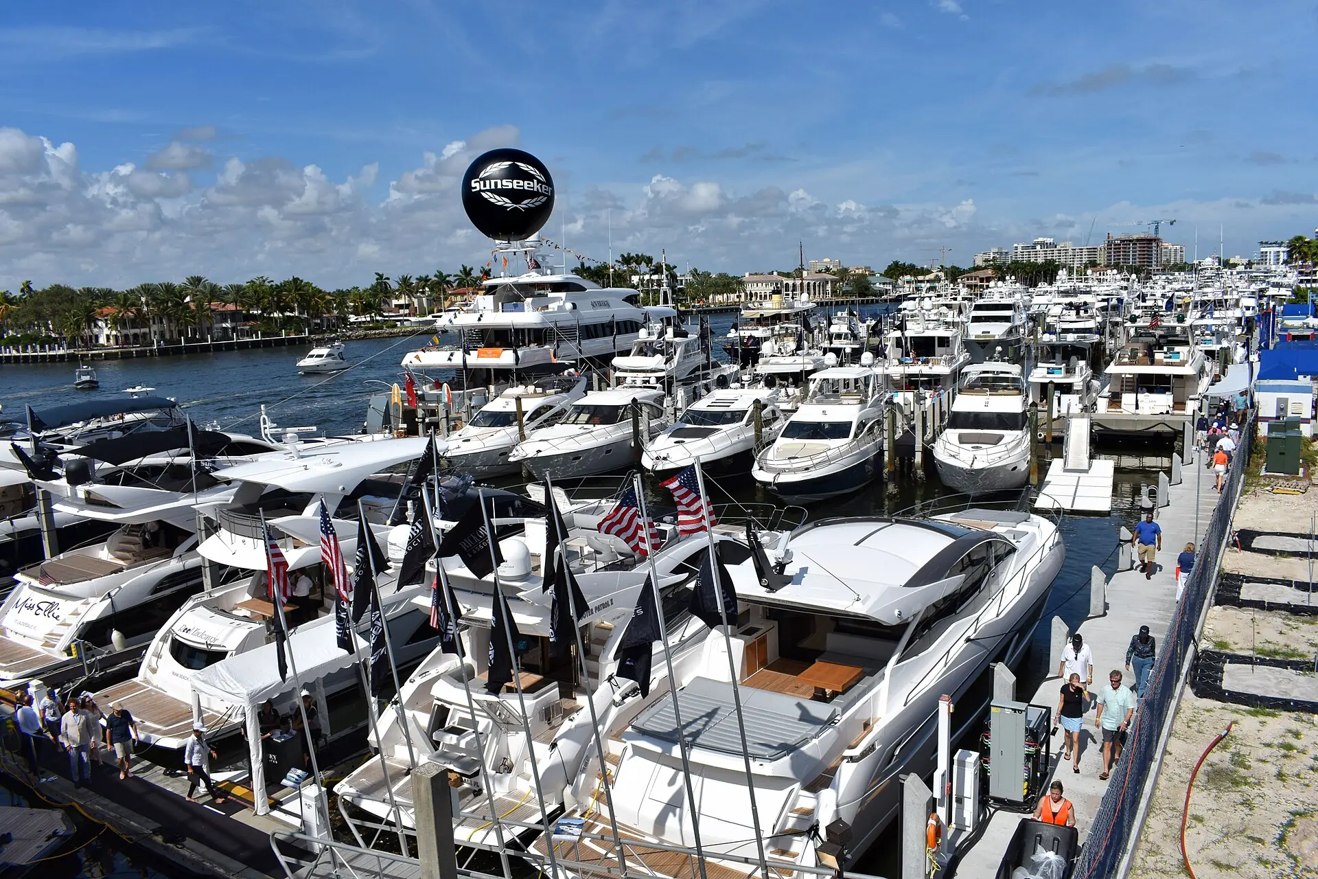 Bahia Mar Yachting Center: numerous luxury yachts docked side-by-side along pontoons at a sunny boat show on the Intracoastal Waterway