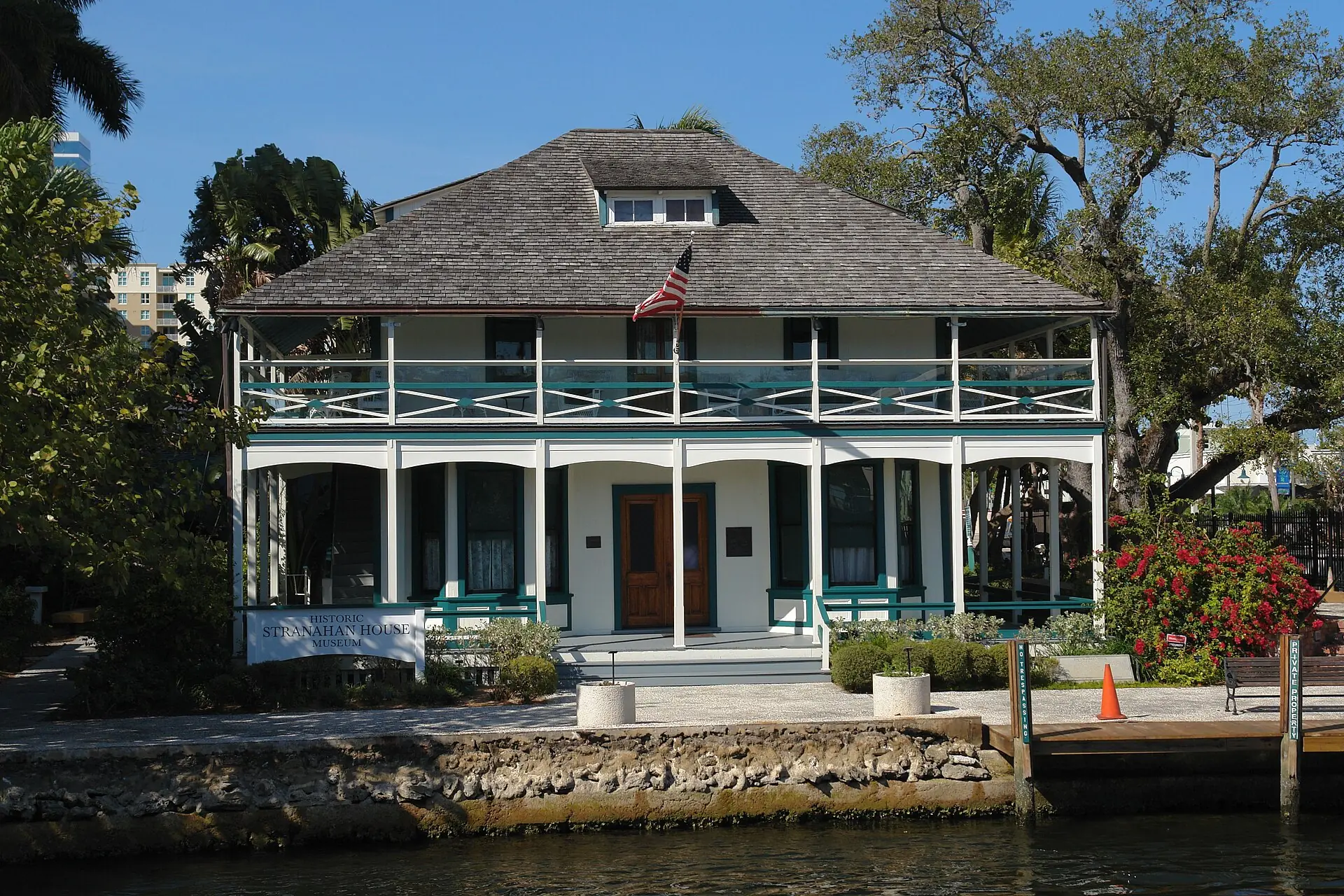 Historic Stranahan House Museum: the historic two-story wooden Stranahan House Museum on the waterfront viewed across the New River under a clear sky