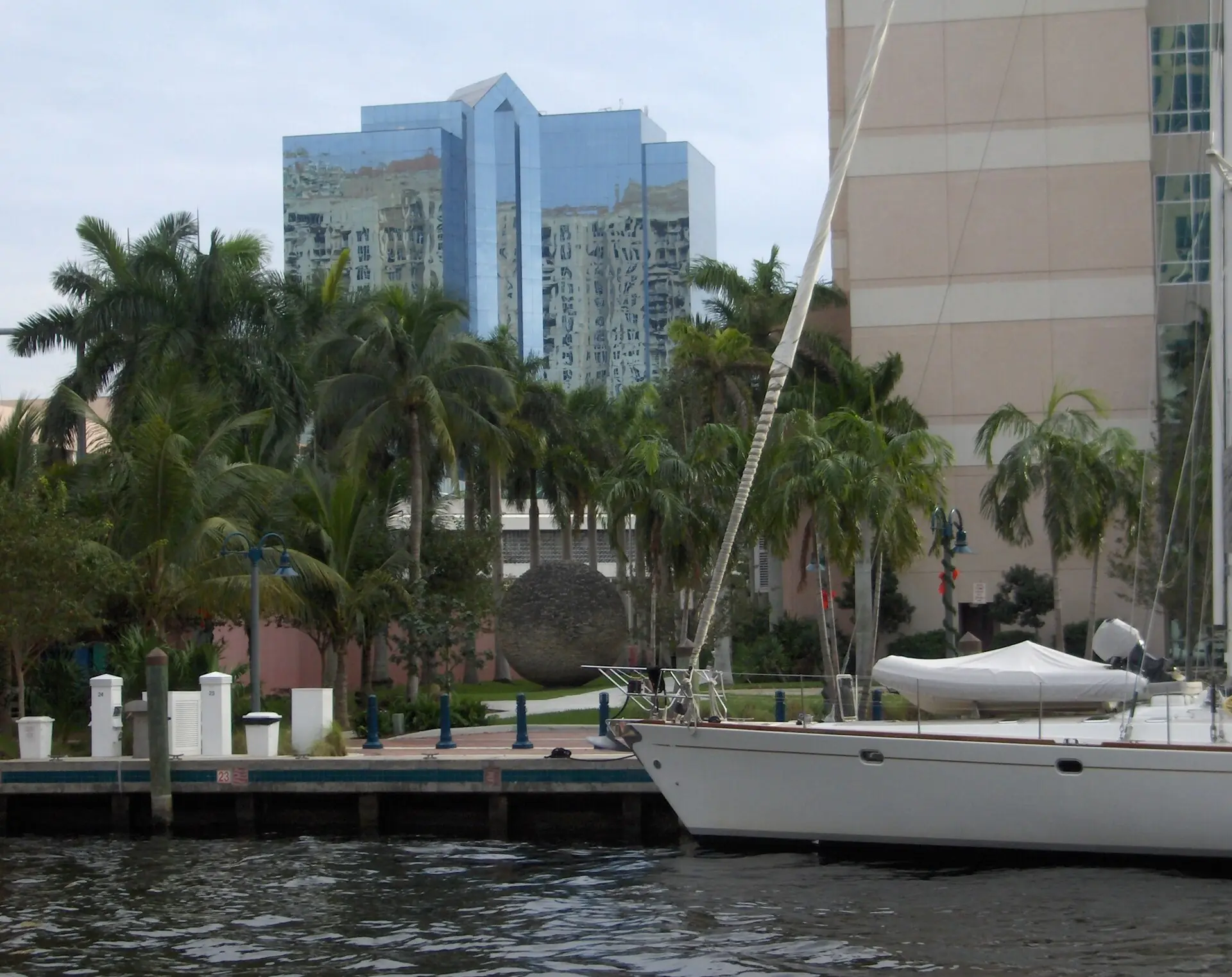 Jungle Queen Riverboat: a boat docked along the New River in downtown Fort Lauderdale, with the Riverwalk, palm trees, and modern glass high-rises in the background