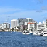 Las Olas Isles: a view across Fort Lauderdale's Intracoastal Waterway toward yachts moored at a marina and coastal high-rise hotels and condominiums